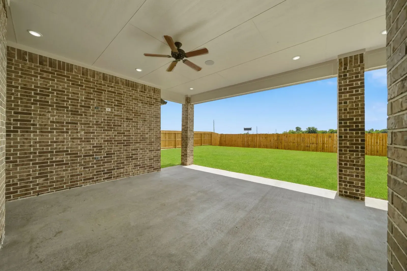 Covered patio with a ceiling fan