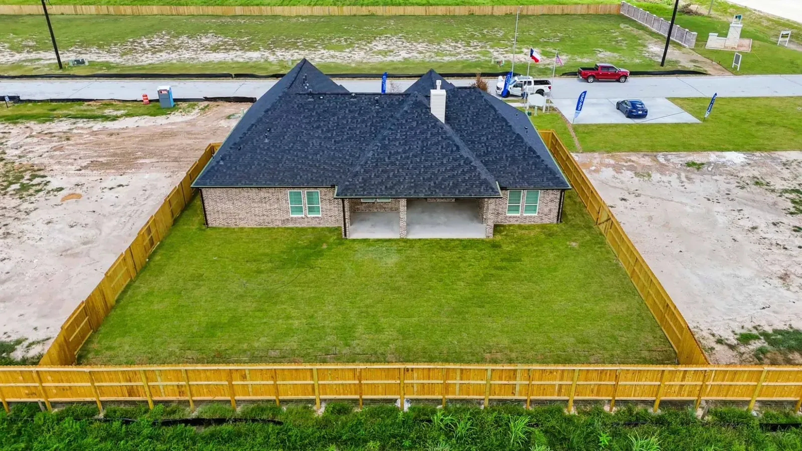Aerial view of the fenced backyard