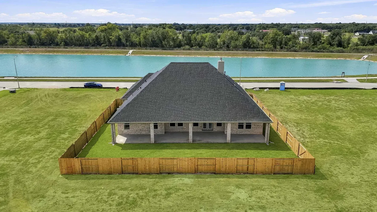 Aerial view of the home and the lake