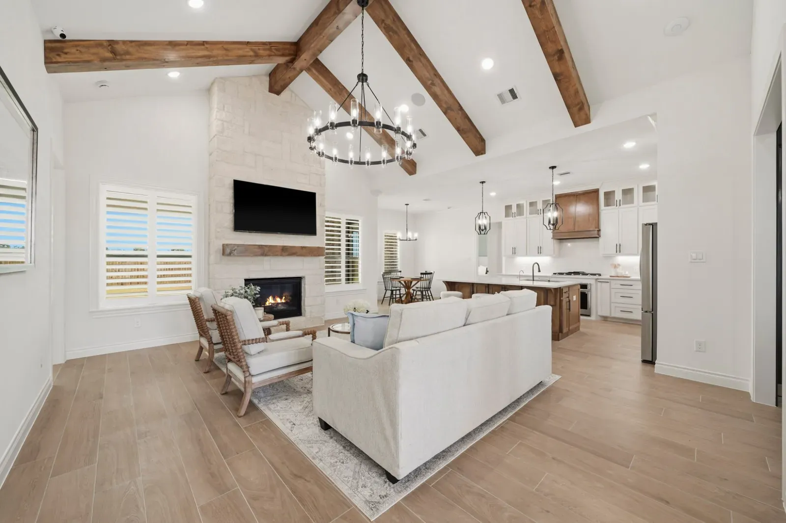 Great room with a stone fireplace