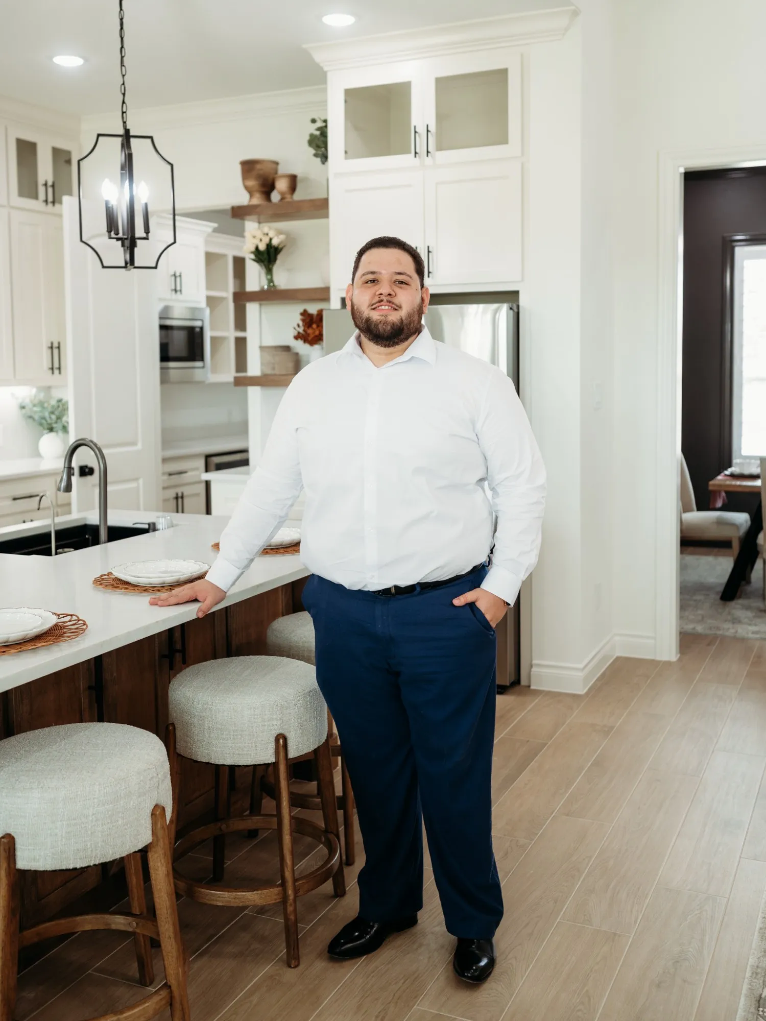 Isaiah Bonilla in a model home kitchen