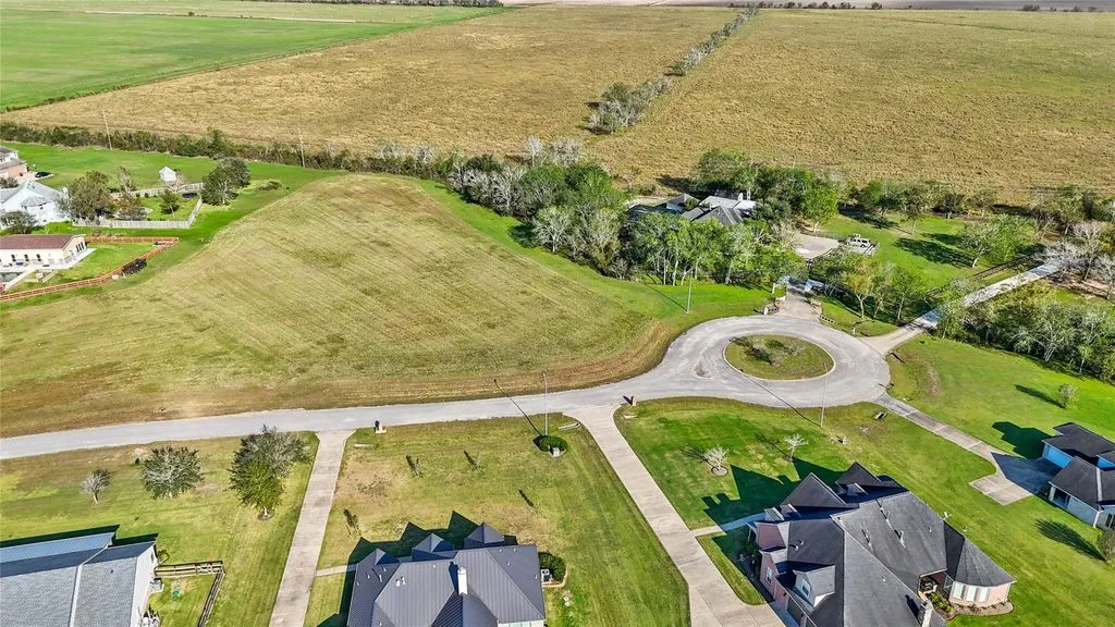 Aerial view of the lot, the cul-de-sac and nearby homes