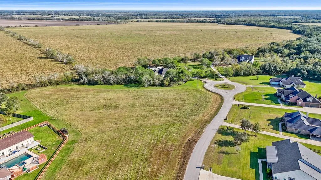 Aerial view of the lot and neighboring homes